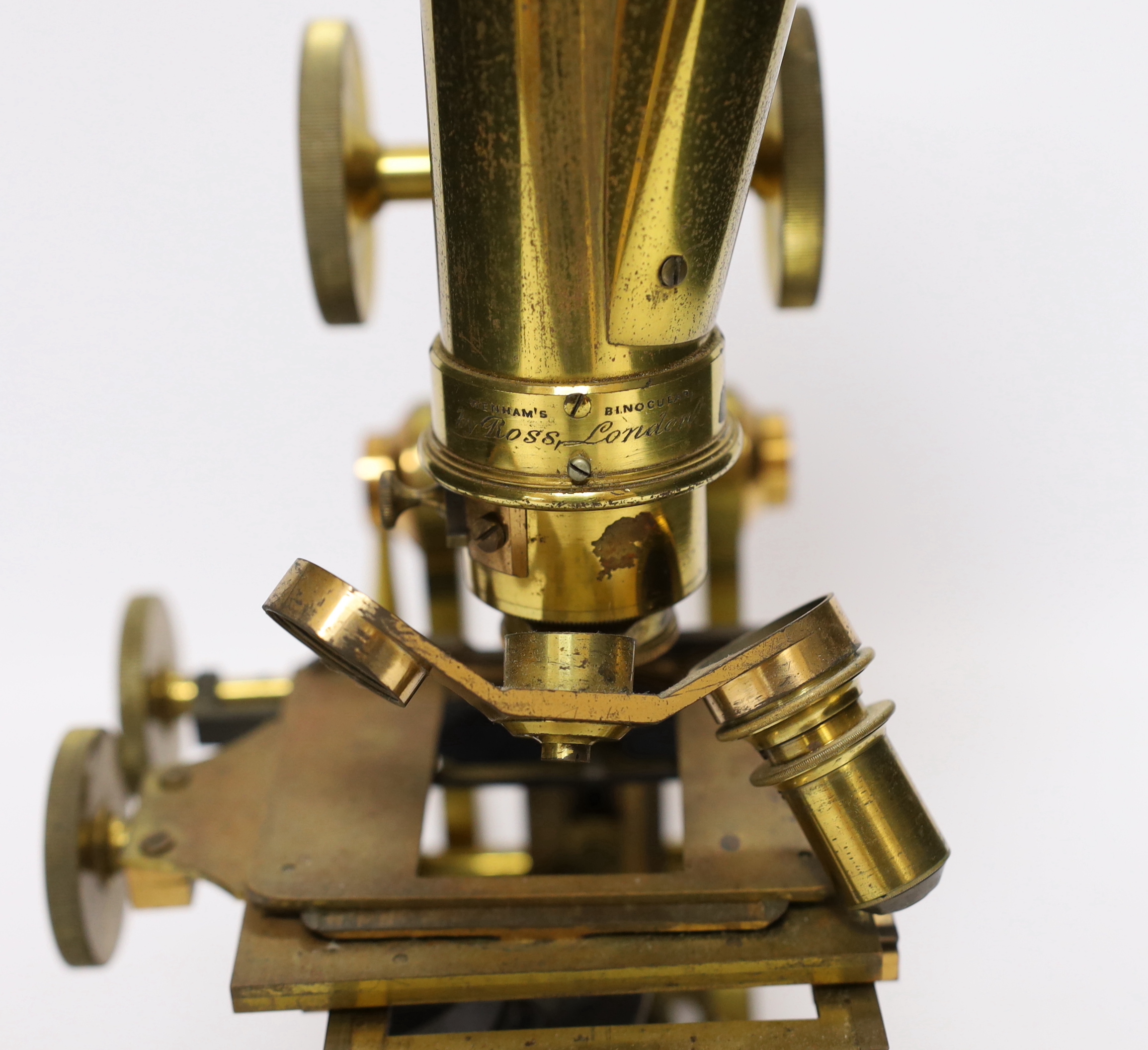 A Ross of London cased 'Wenham's' binocular brass microscope, wooden case with fitted interior and containing three sets of lenses, case 41.5cm high